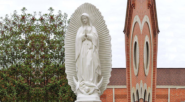 Our Lady of Guadalupe statue -- marble carved devotional figure
